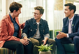 A TD colleague meets with a same-sex couple in a branch office to discuss their finances.